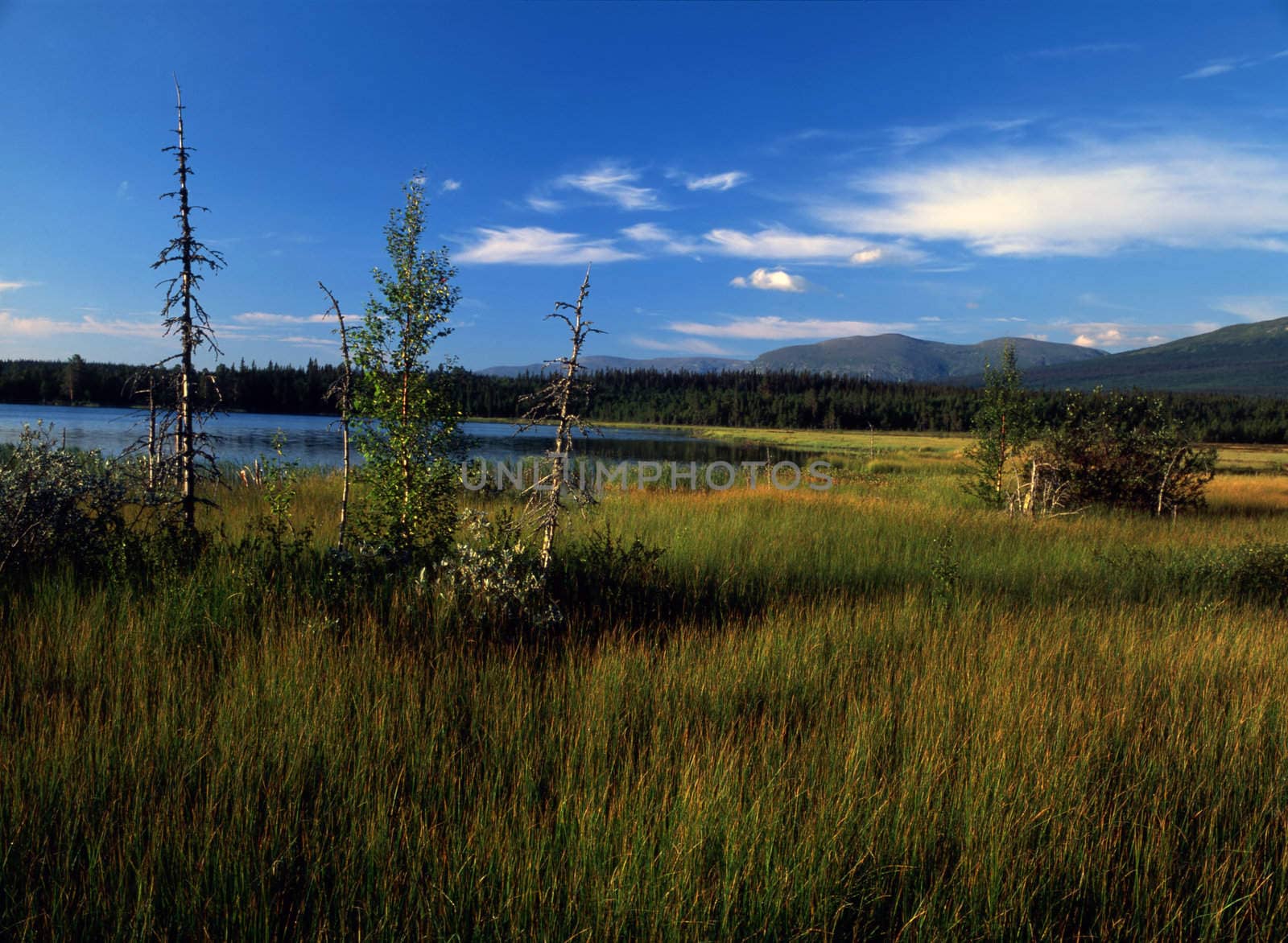 Beautiful autumn landscape of lake ,mountain and blue sky