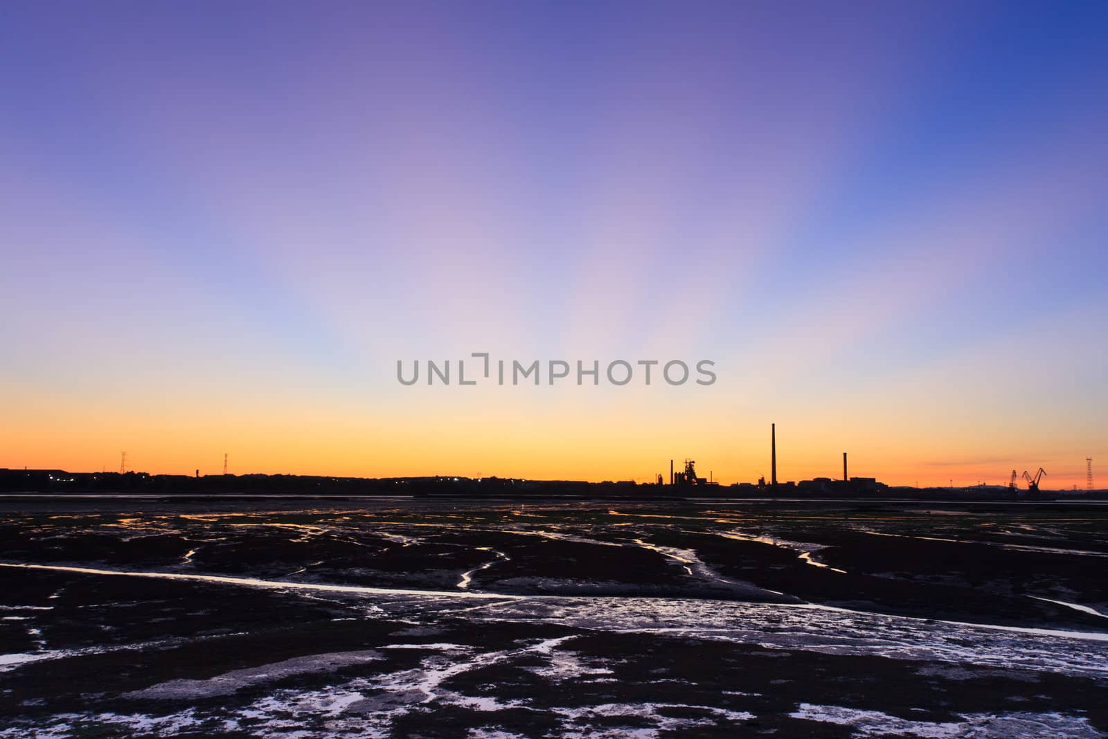 Sunset on Tejo river during low tide.