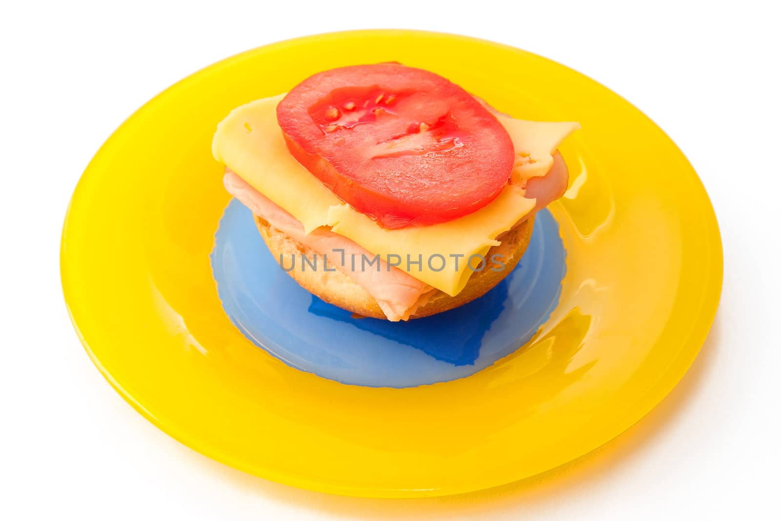 Colorful sandwich on the yellow plate