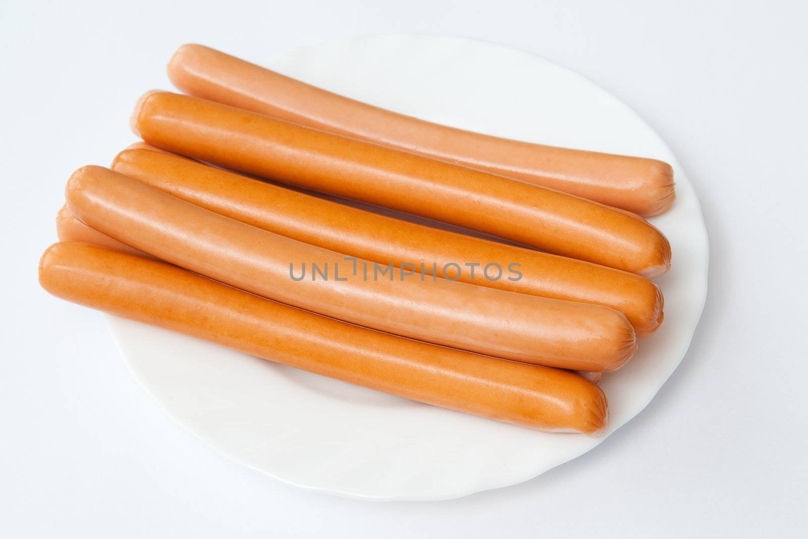 Sausages on the white plate