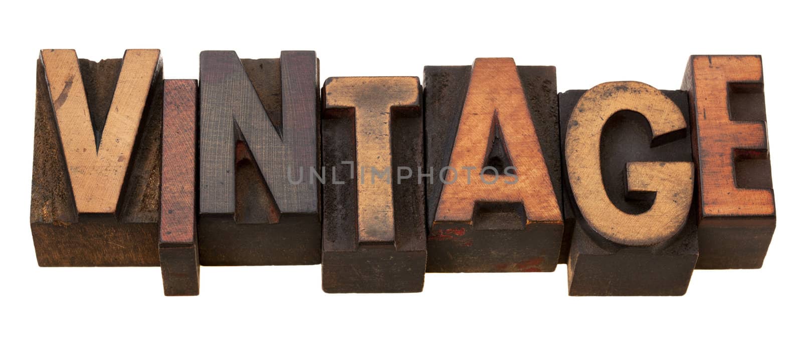 vintage, word in antique wooden letterpress printing blocks, stained by color inks, isolated on white