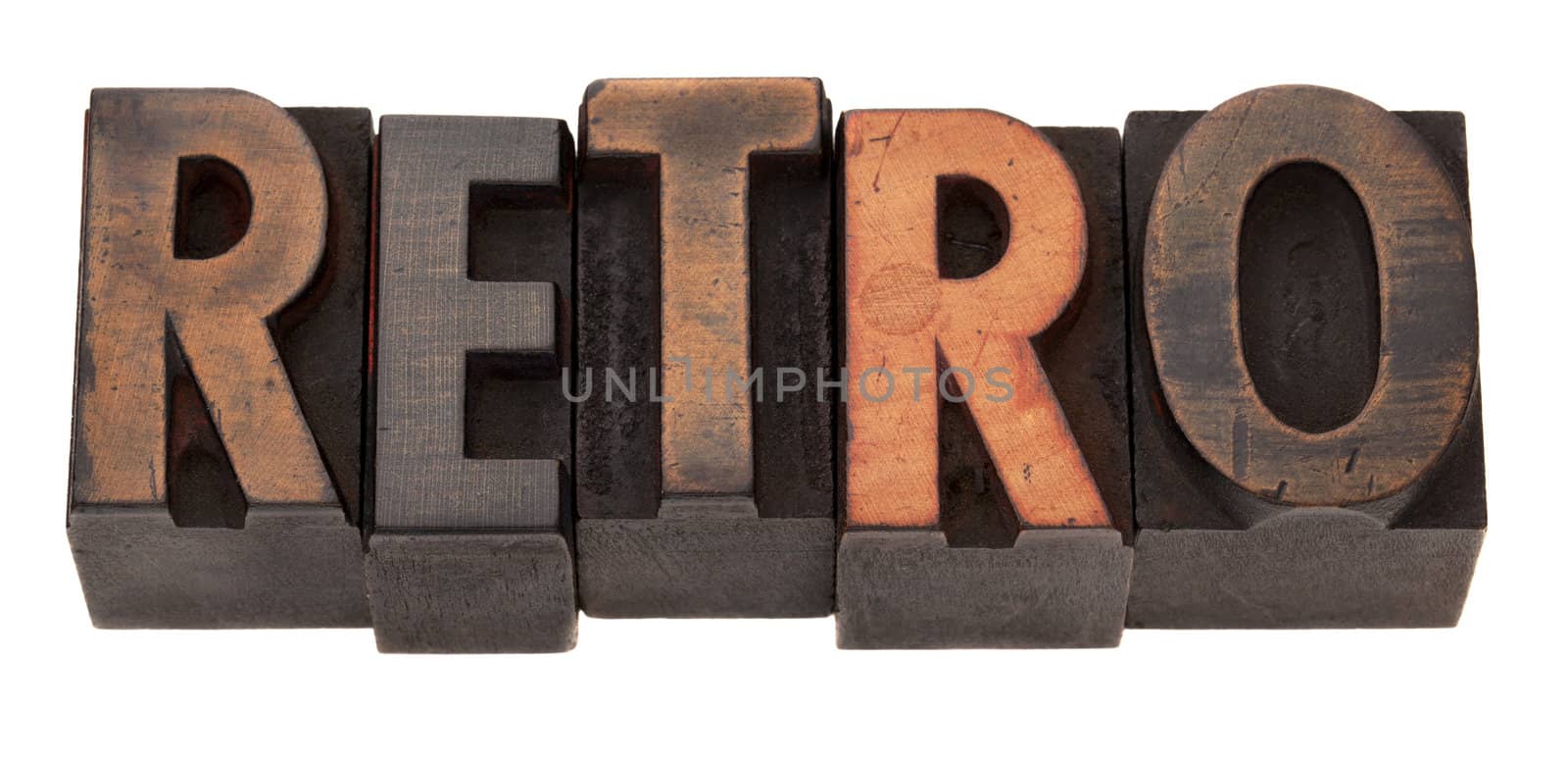 retro word in antique wooden letterpress printing blocks, stained by color inks, isolated on white