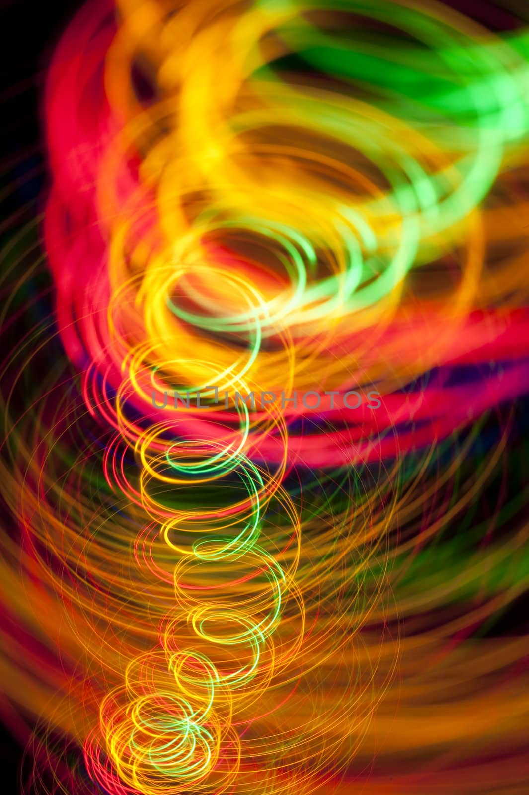 a spiral of vividly coloured lines of light on a black background