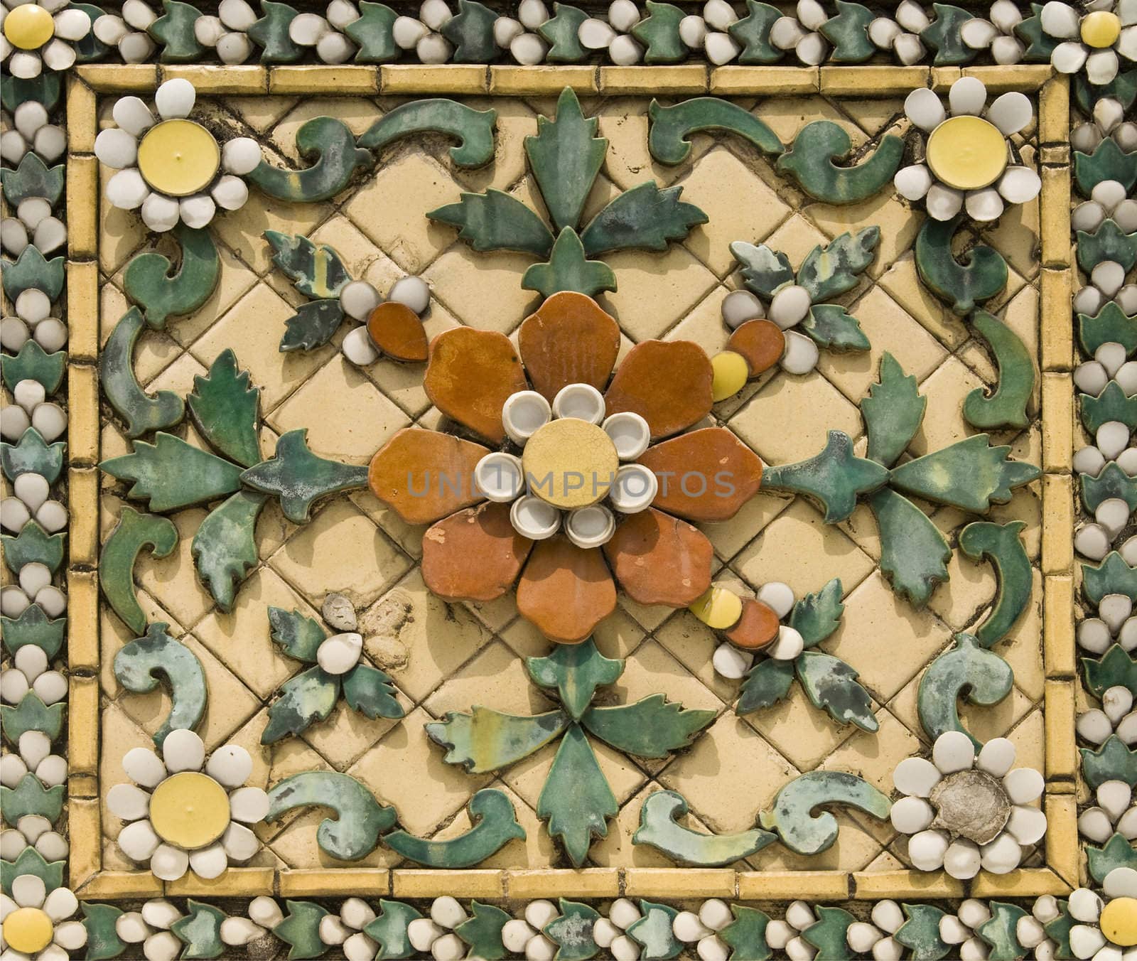 Old floral, ceramic tile in Grand Palace, Thailand