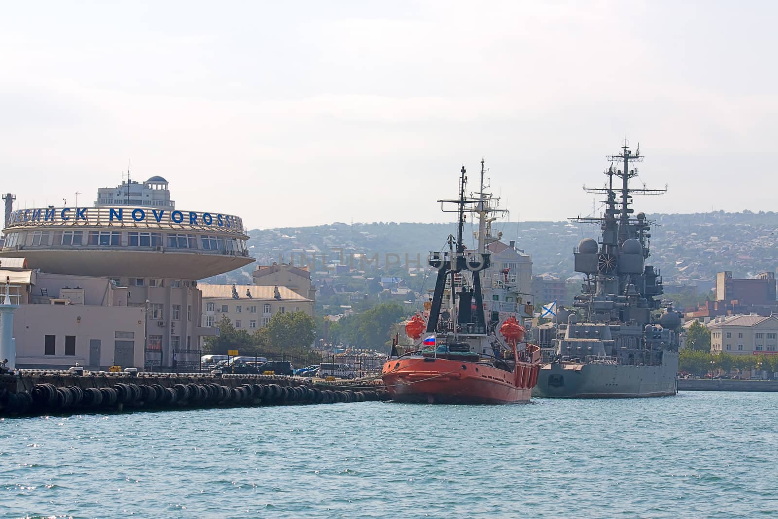 View of ships in port against blue sky, Novorossiysk, Russia.