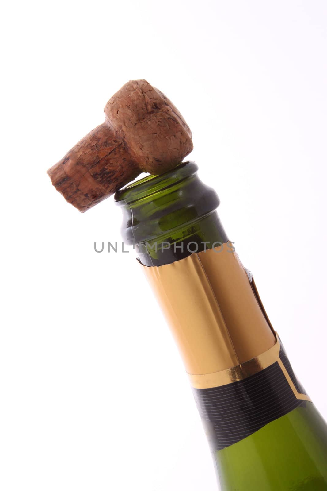 Champagne bottle and cork  on a plain white background.