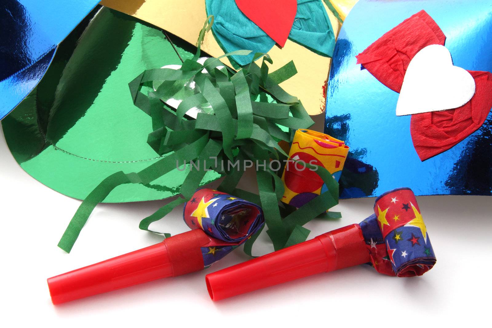 Party hats and party blowers on a plain white background.