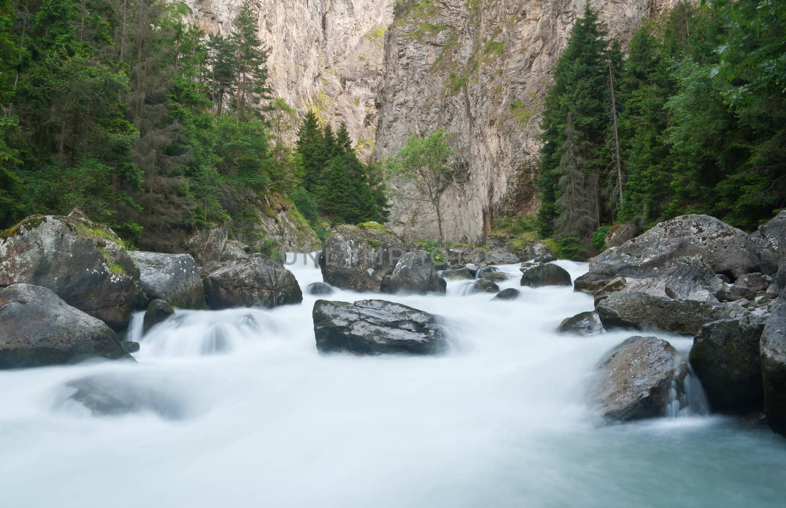 beautiful stream between rocks in Pre Saint Didier, Aosta. Italy