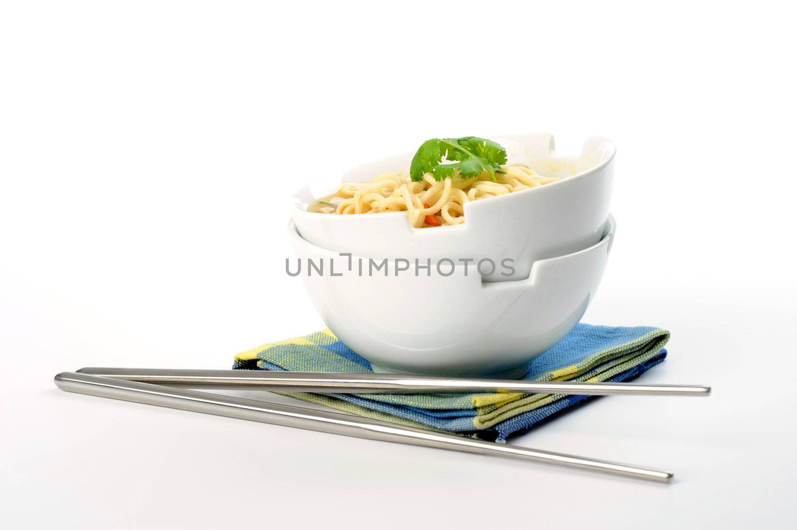 Bowls of oriental style noodles on a white background.