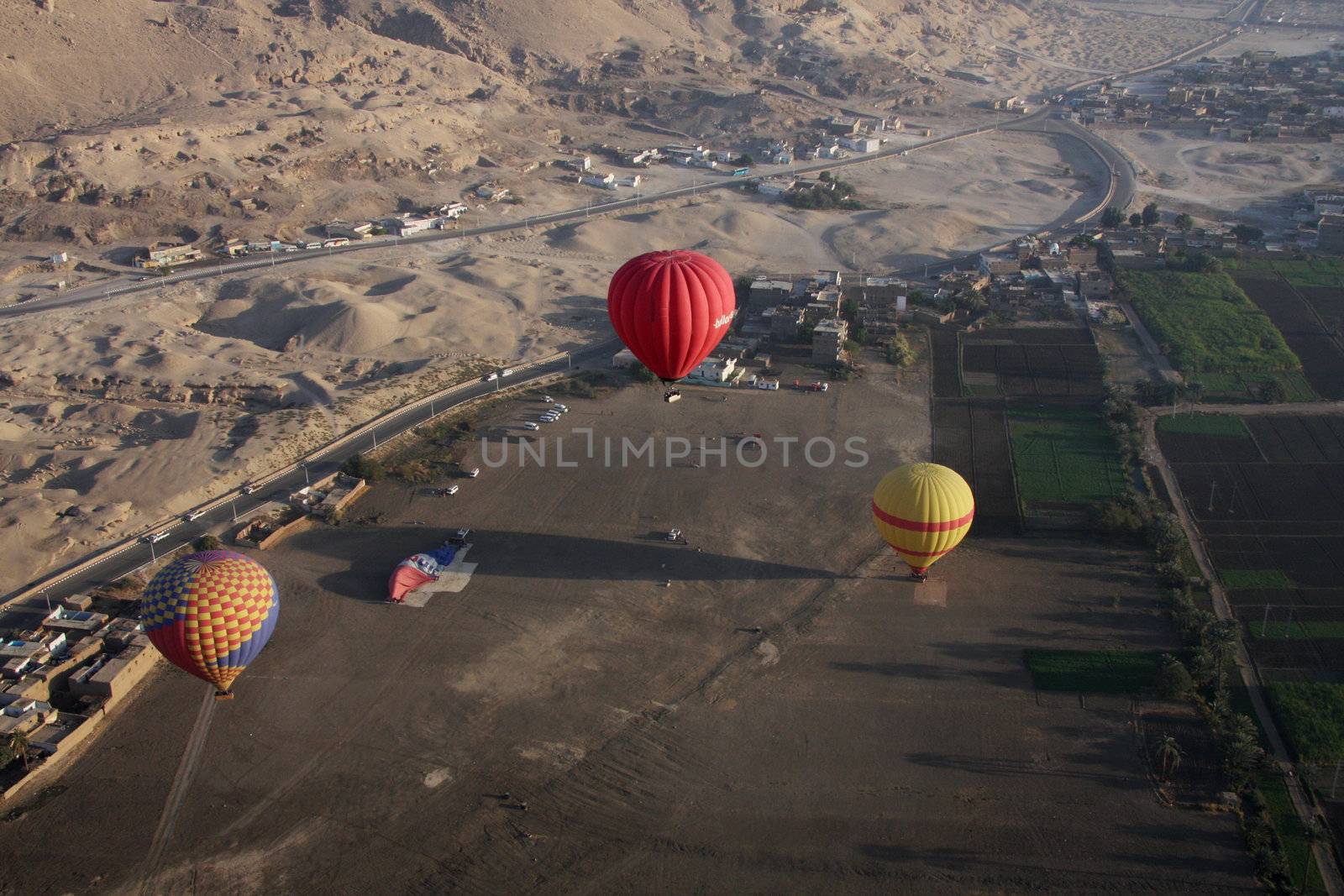 3 Hot air balloons taking off from Luxor Egypt, aerial shot