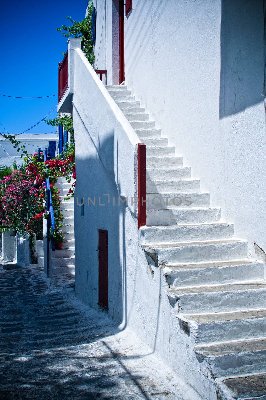 White steps leading to a House of Mykonos, Greece