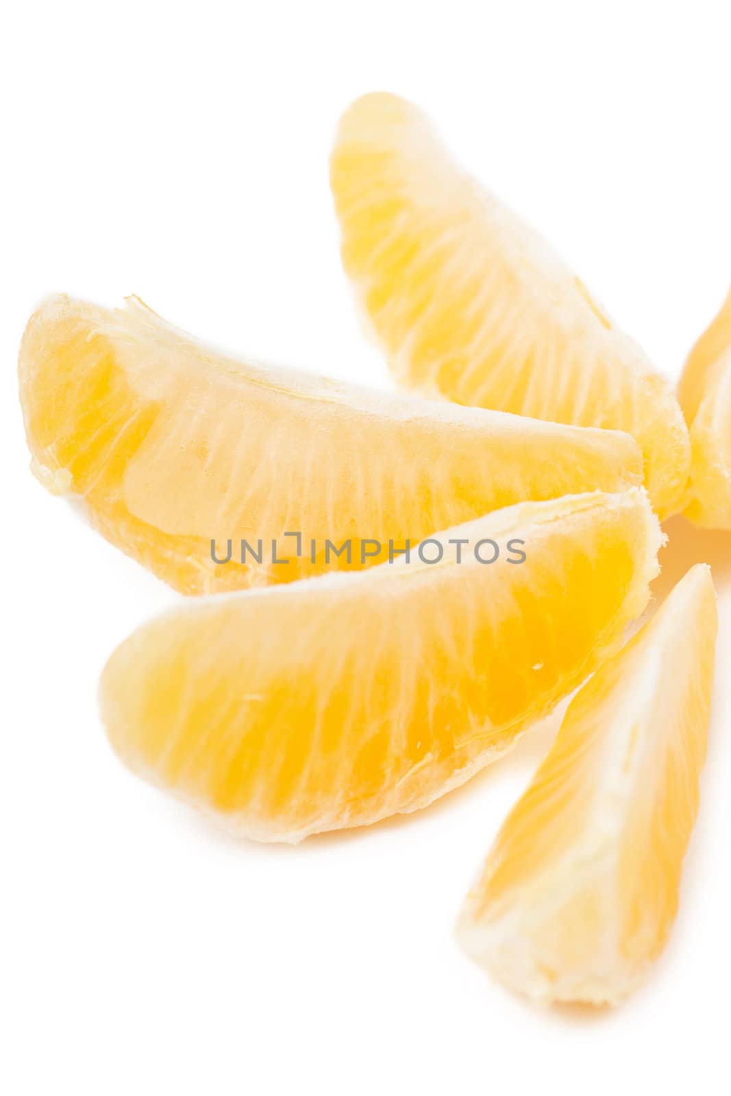 Closeup view of tangerine sections isolated on the white