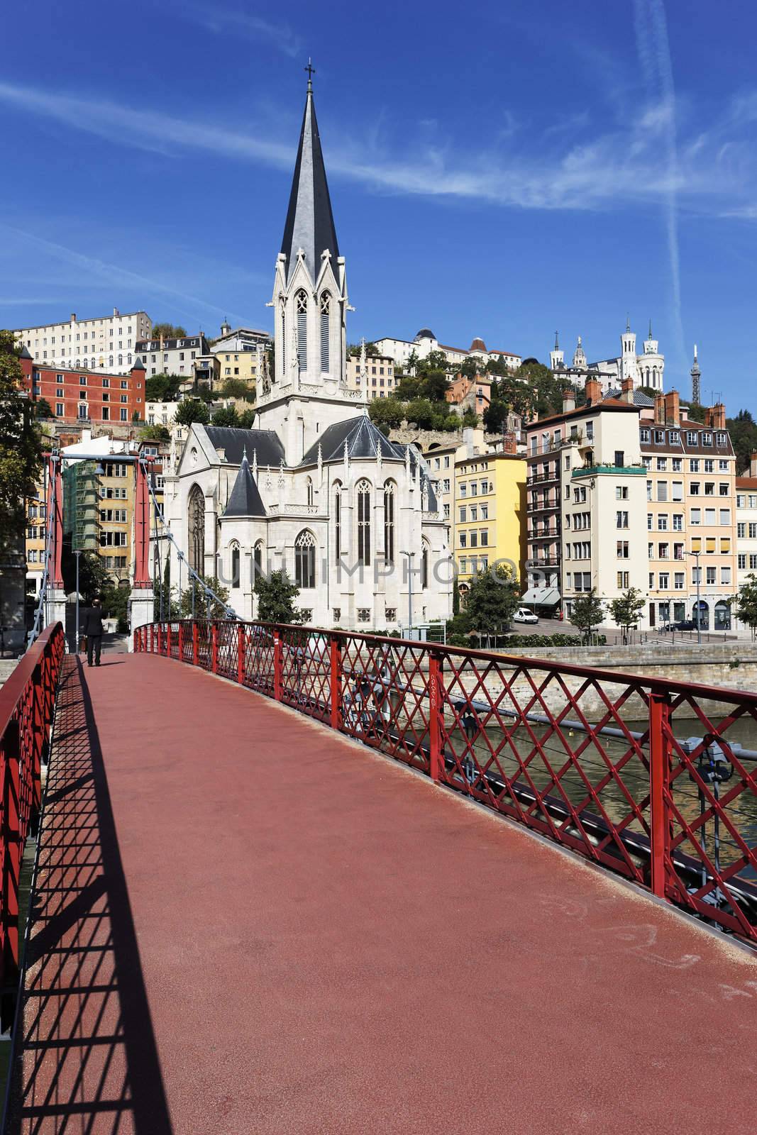 red footbridge and church by vwalakte