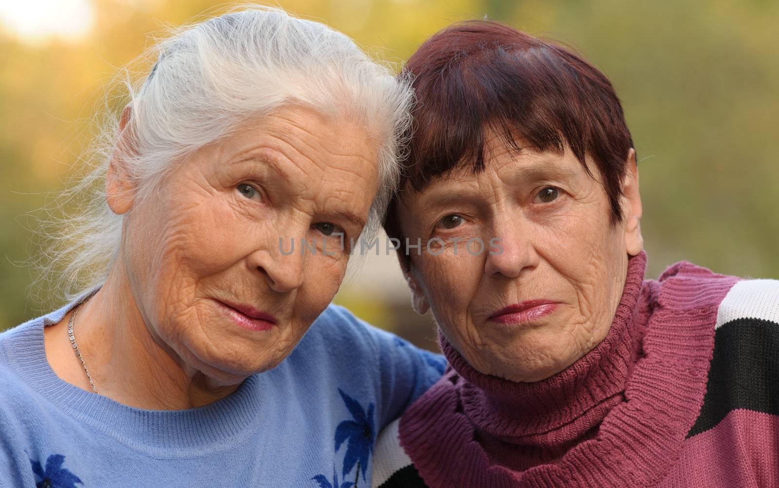Two sisters of old age. A photo on outdoors
