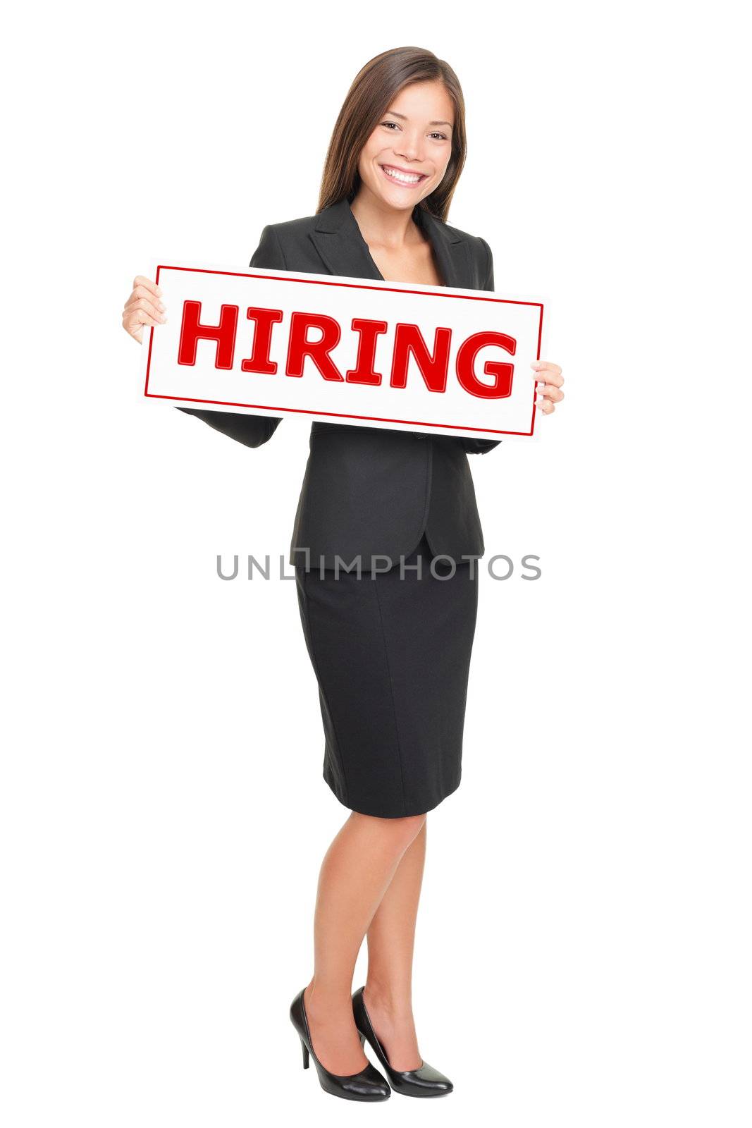 Hiring job woman holding hiring sign. Young attractive smiling Caucasian / Asian businesswoman isolated on white background.