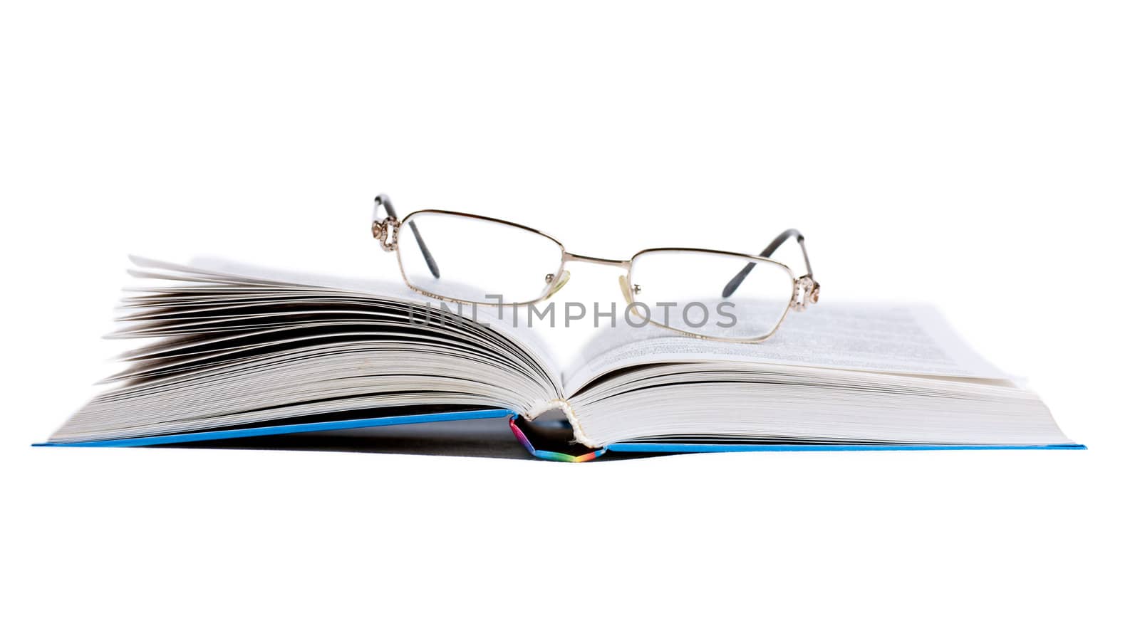 Opened book and glasses on it isolated on the white