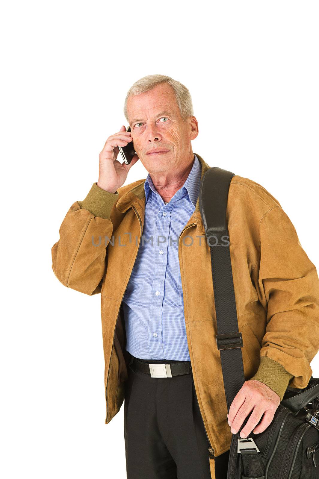 Senior man travelling and taking on his smartphone