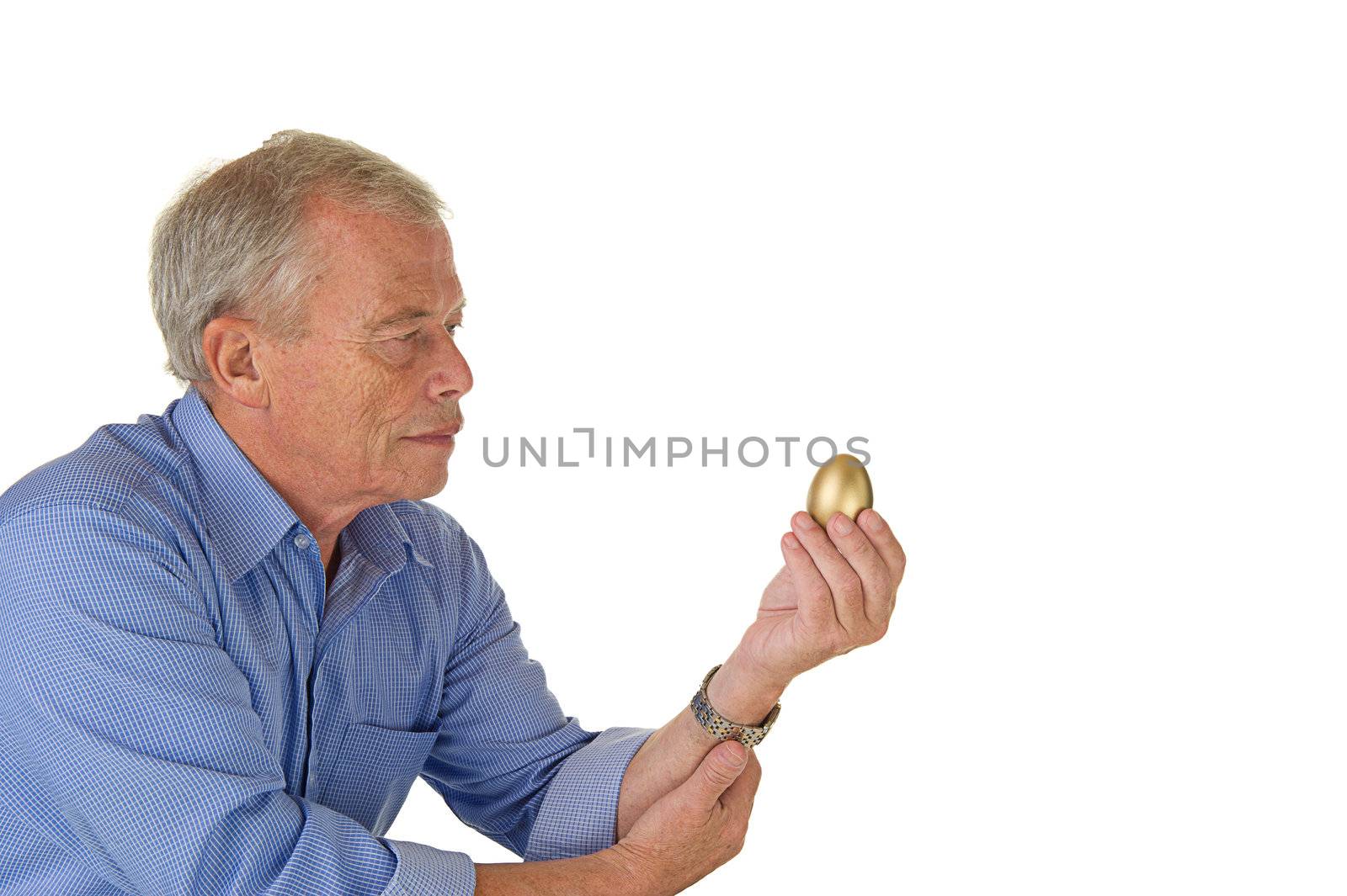 Senior man with golden egg by MOELLERTHOMSEN