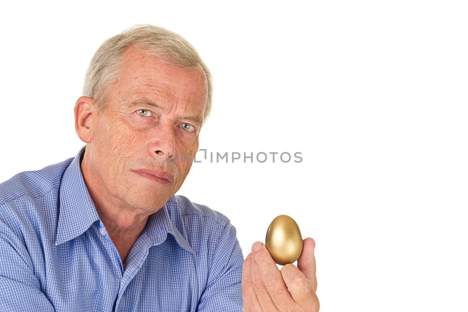 Senior man with his golden egg. His fortune/savings. Pleasent age.