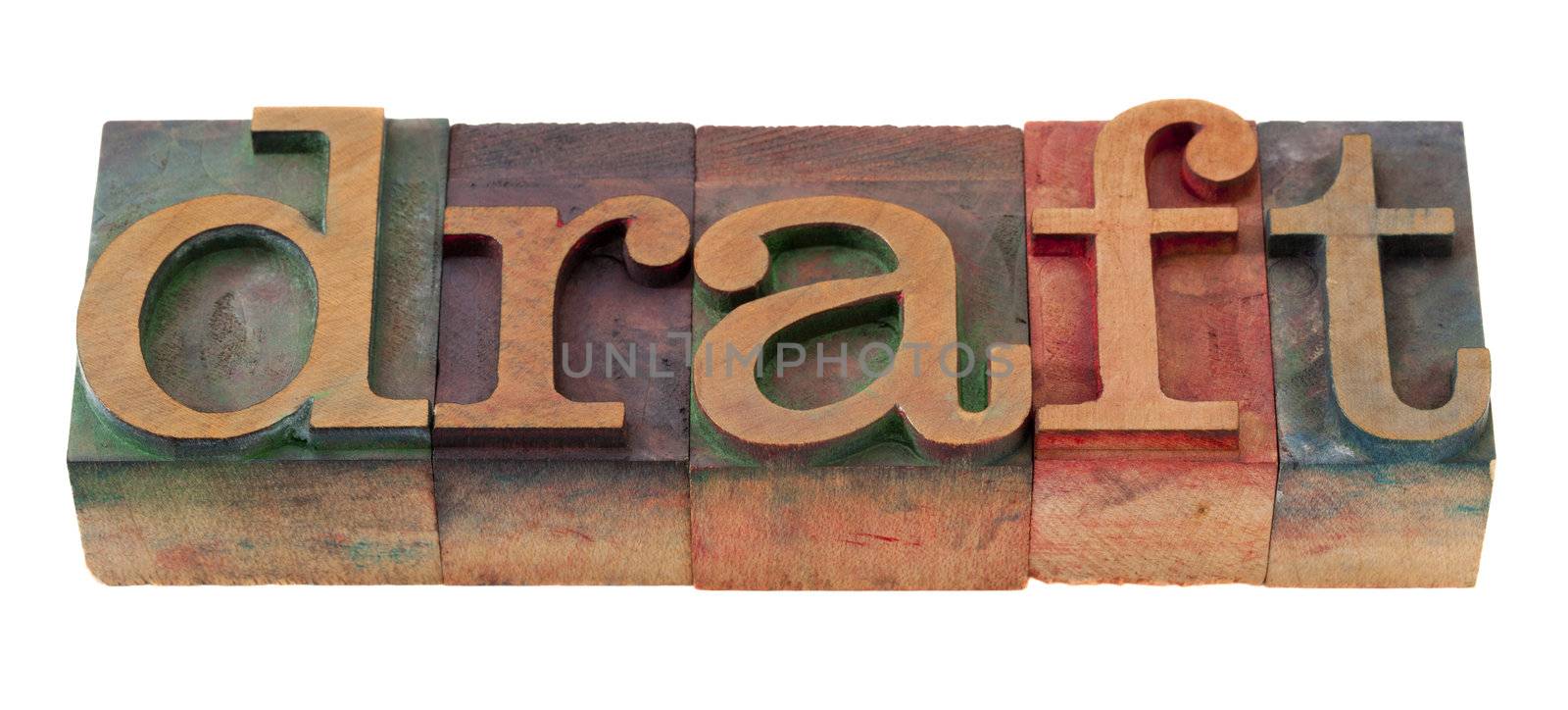 draft  word in vintage wooden letterpress printing blocks, stained by color inks, isolated on white