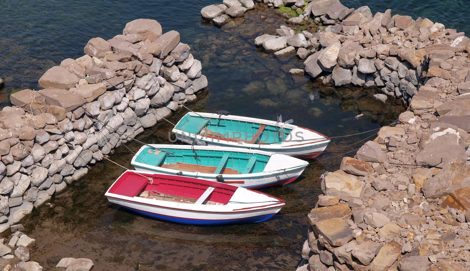 Three wooden boats, lake Titicaca, Amantani Isle