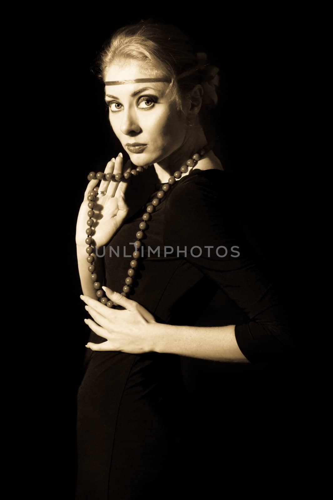 Retro style woman dress with necklace, sepia