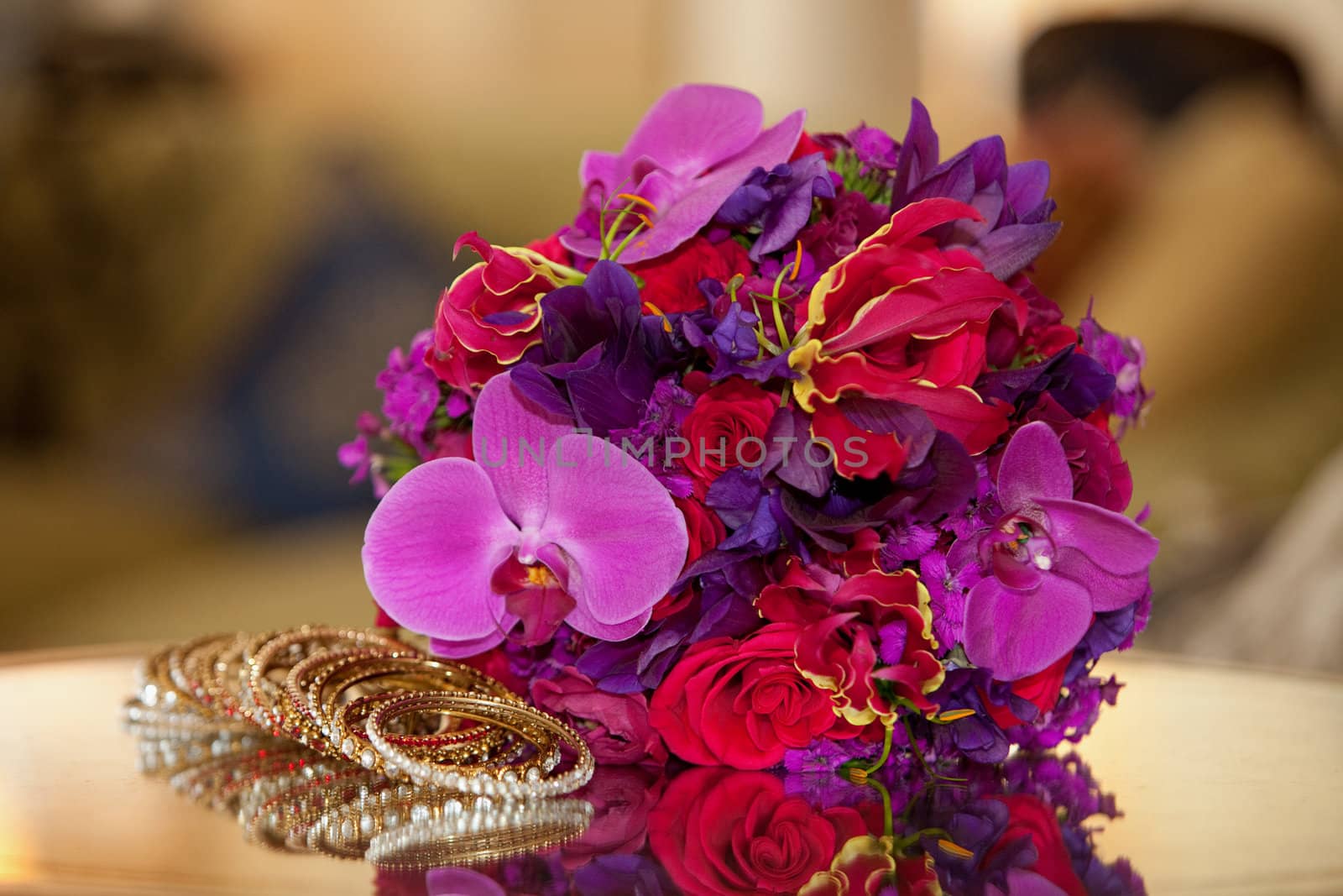 Colored Flowers lying on a mirrored table