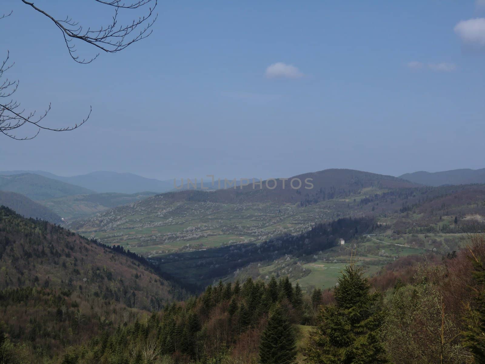 Kind from a mountain ridge on a valley in Carpathians Mountains