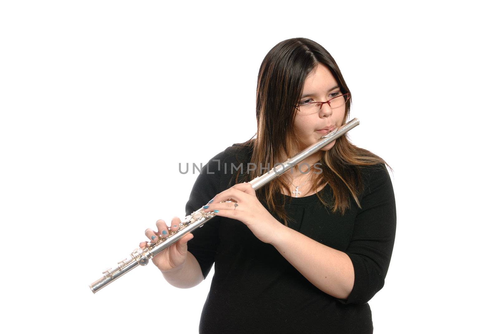 A teenage girl is playing the flute, isolated against a white background.