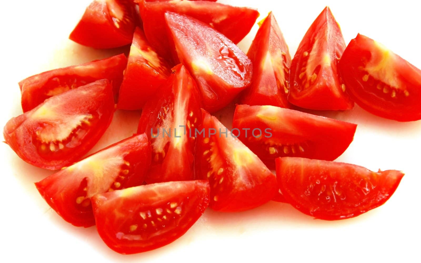 red ripe tomato slices over white background