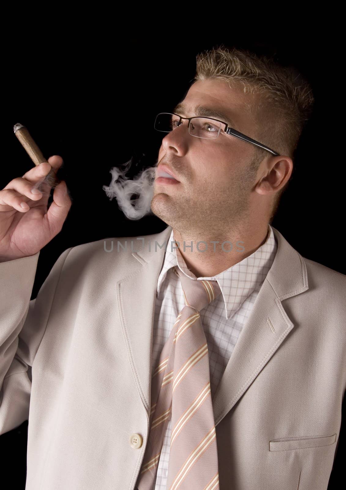 Businessman smoking cigar