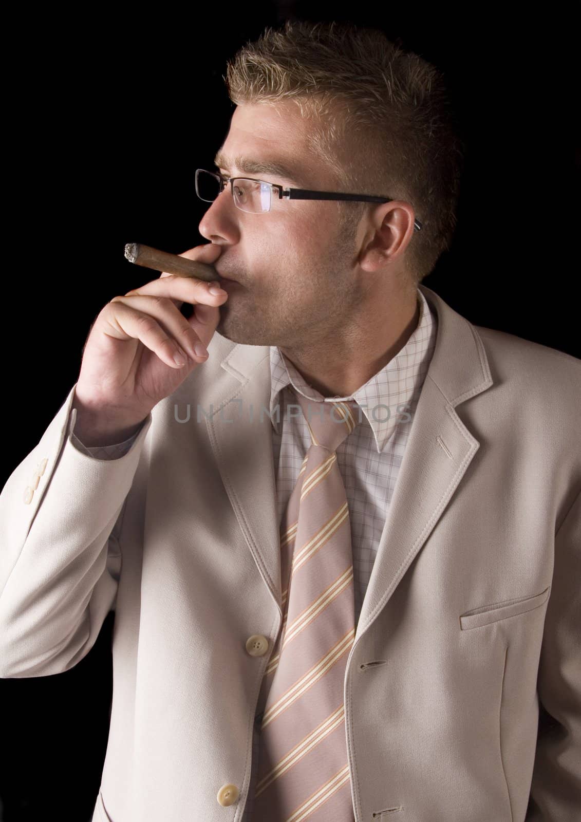 Businessman smoking cigar