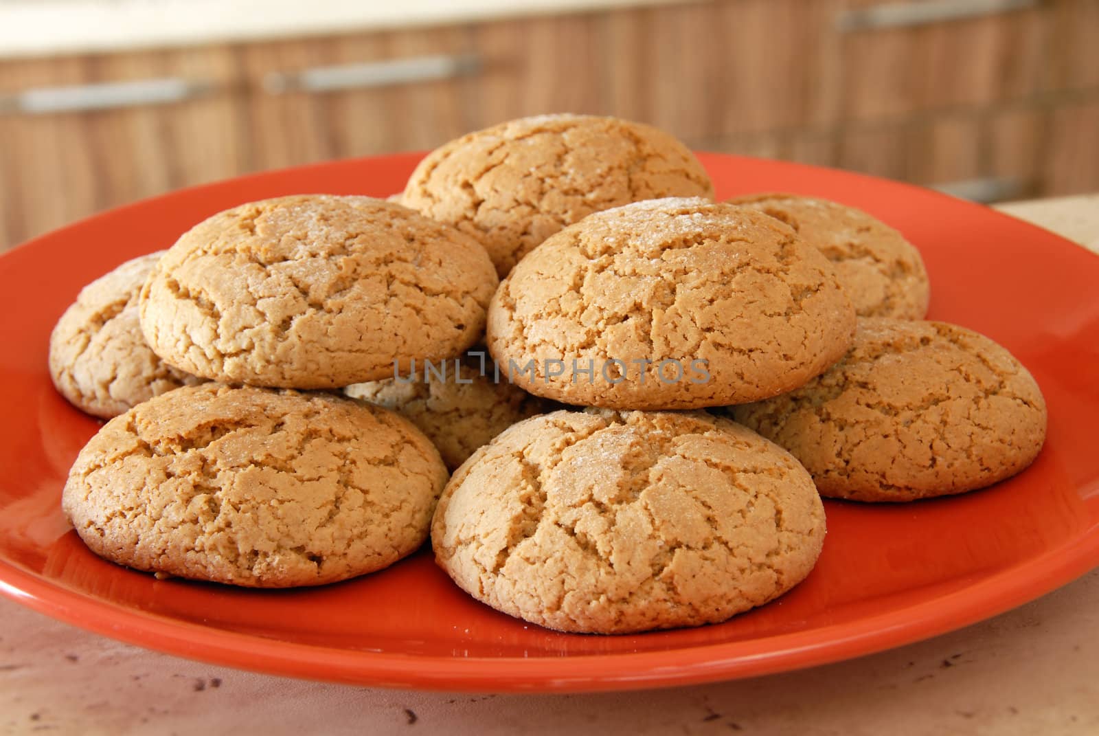 heap of fresh appetizing oatmeal cookies on red plate