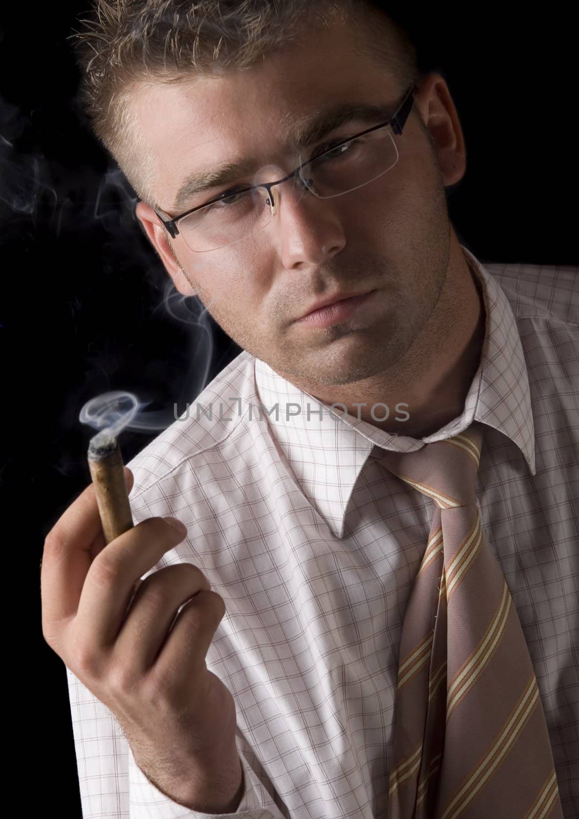 Businessman smoking cigar