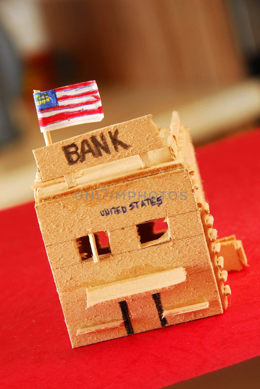 Wooden model of bank by simply