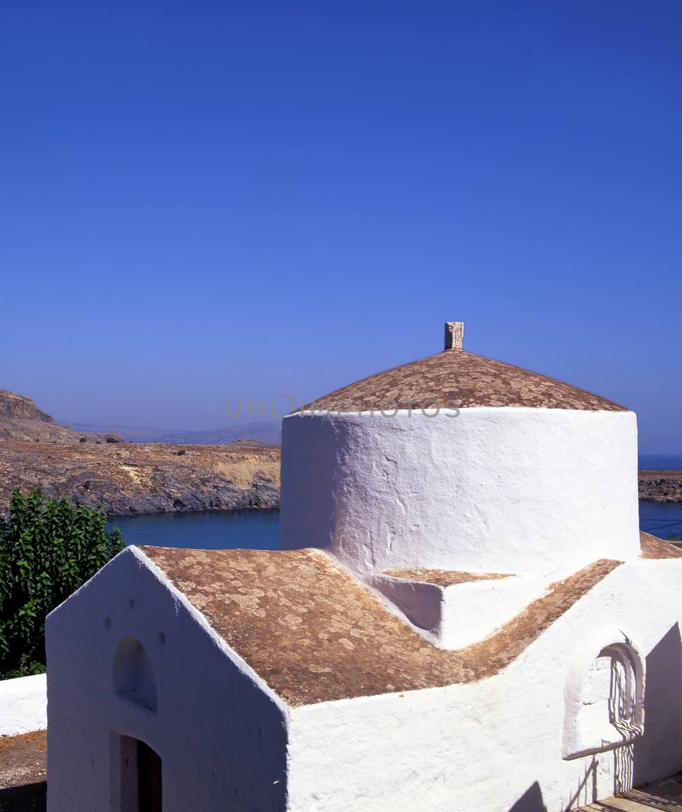 A church overlooking the bay of Lindos on the Greek island of Rhodes
