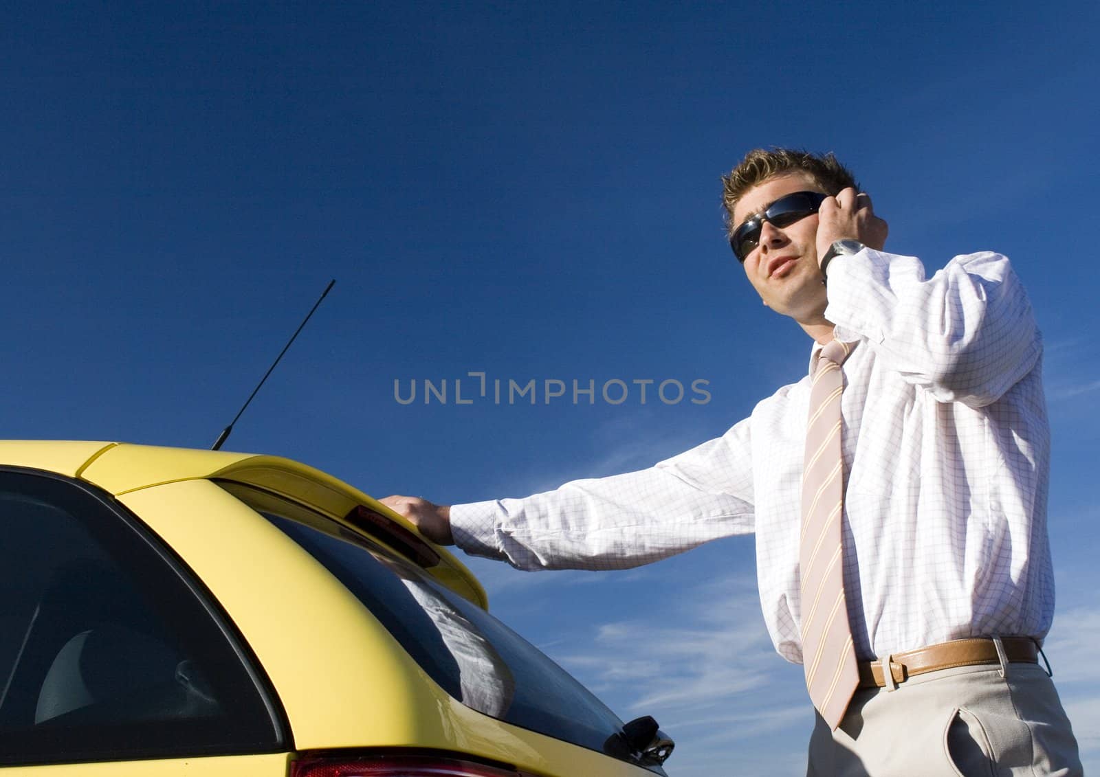 Businessman talking on mobile phone by shiffti