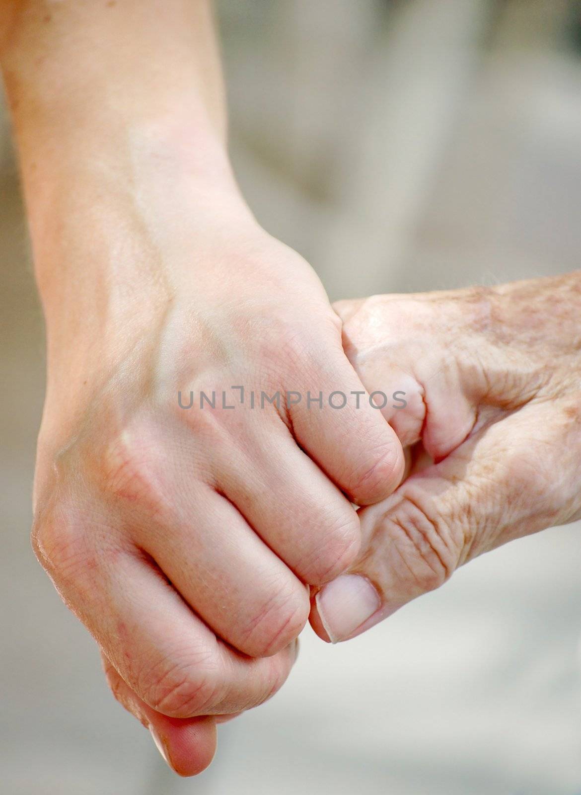 Young man gives her grandma her hand