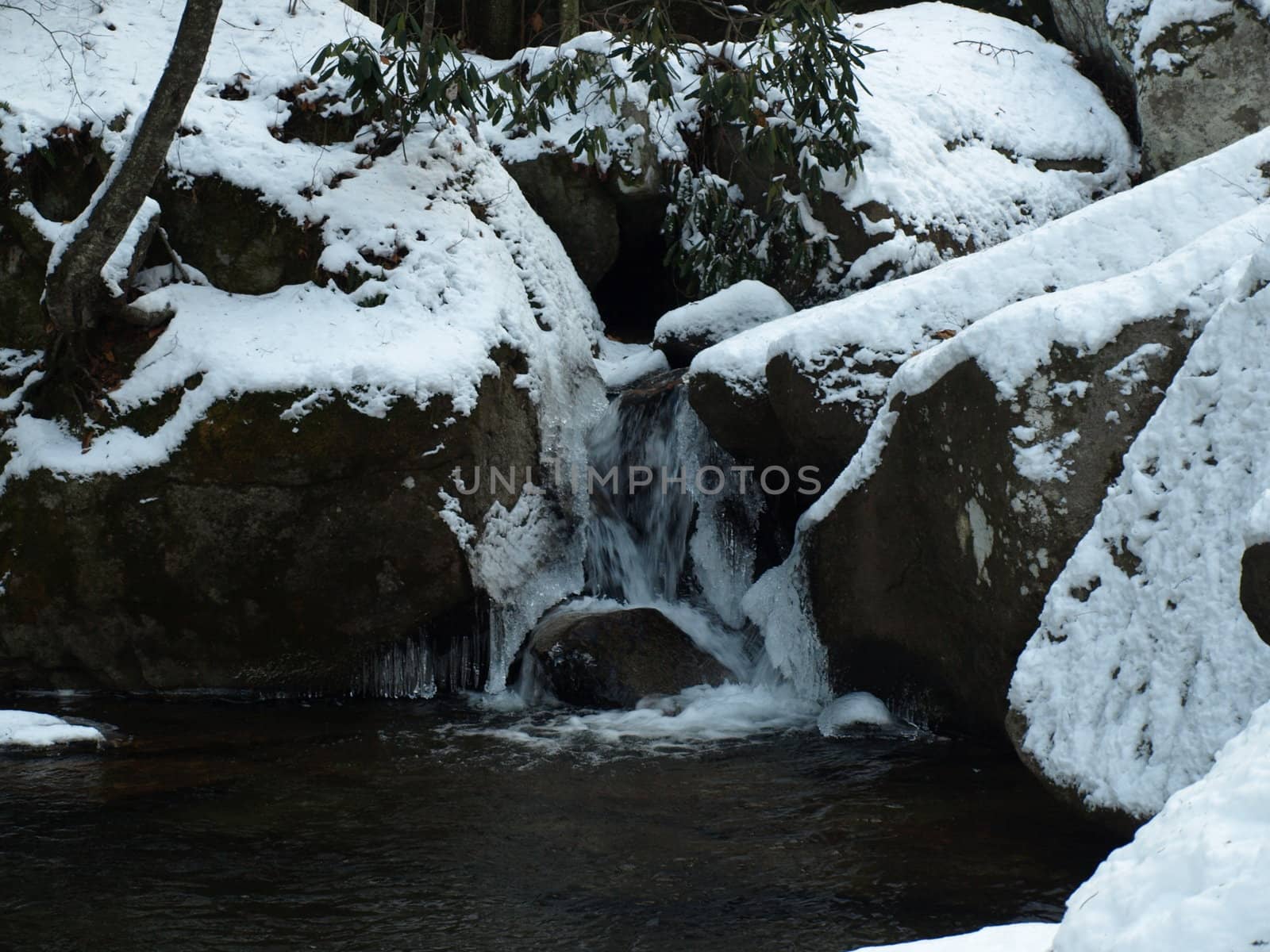 View along the Jacobs Fork River at South Mountain State Park after a snow fall