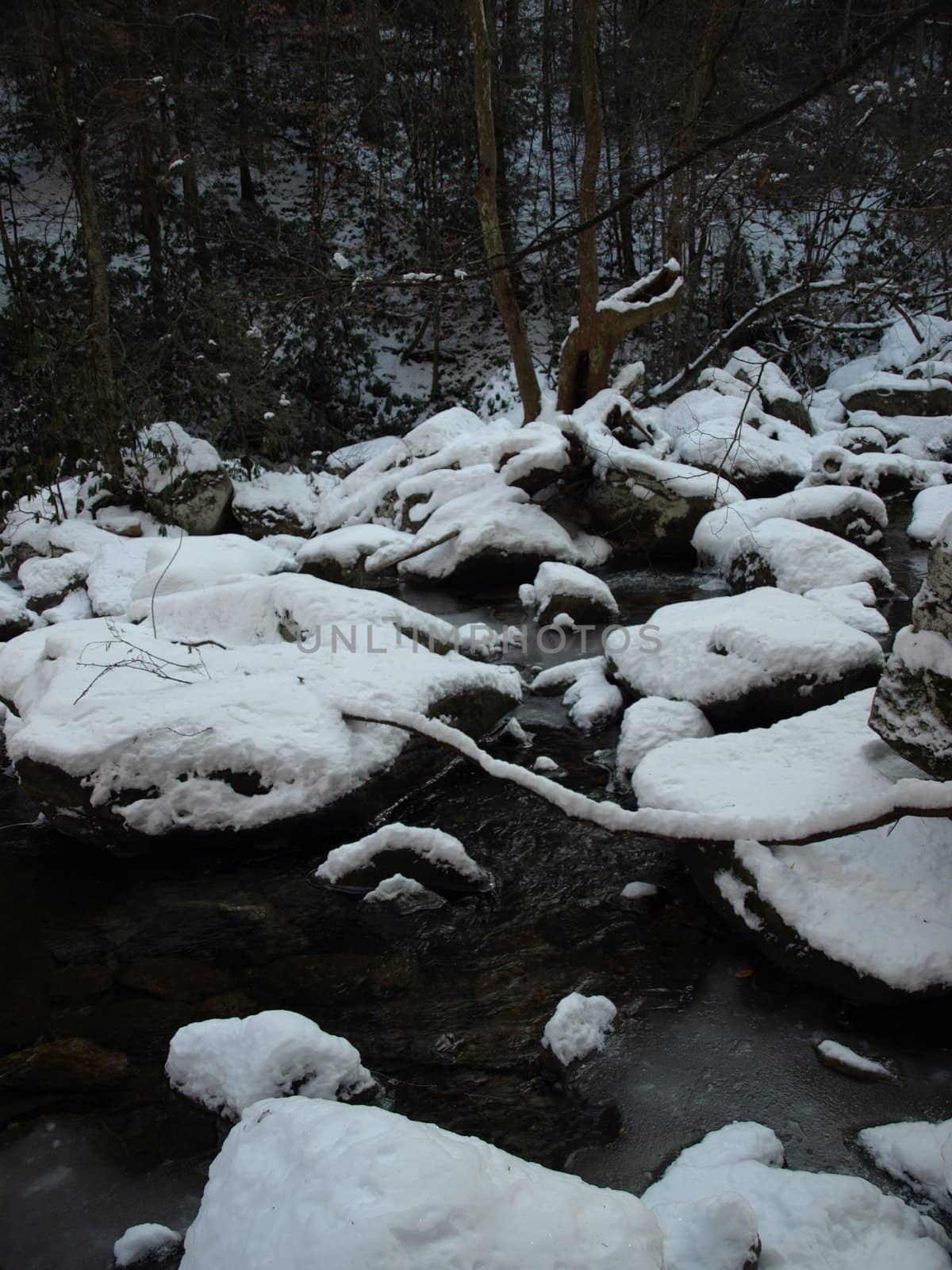 View along the Jacobs Fork River at South Mountain State Park after a snow fall