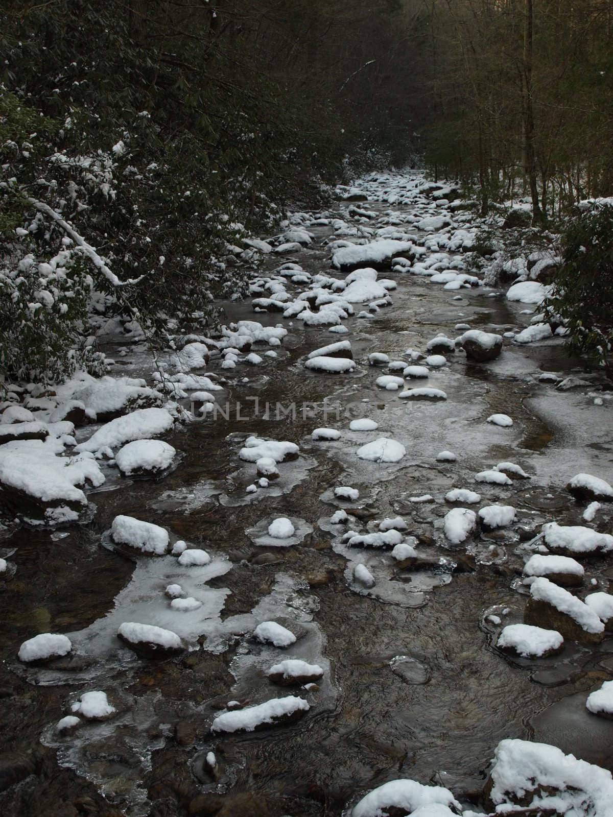 View along the Jacobs Fork River at South Mountain State Park after a snow fall