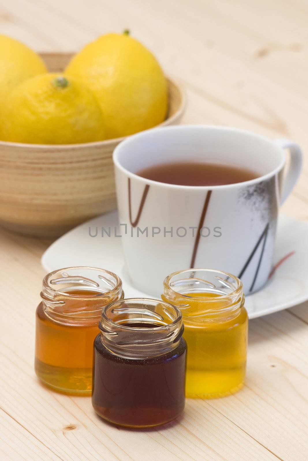 cup of tea, honey and fresh lemons