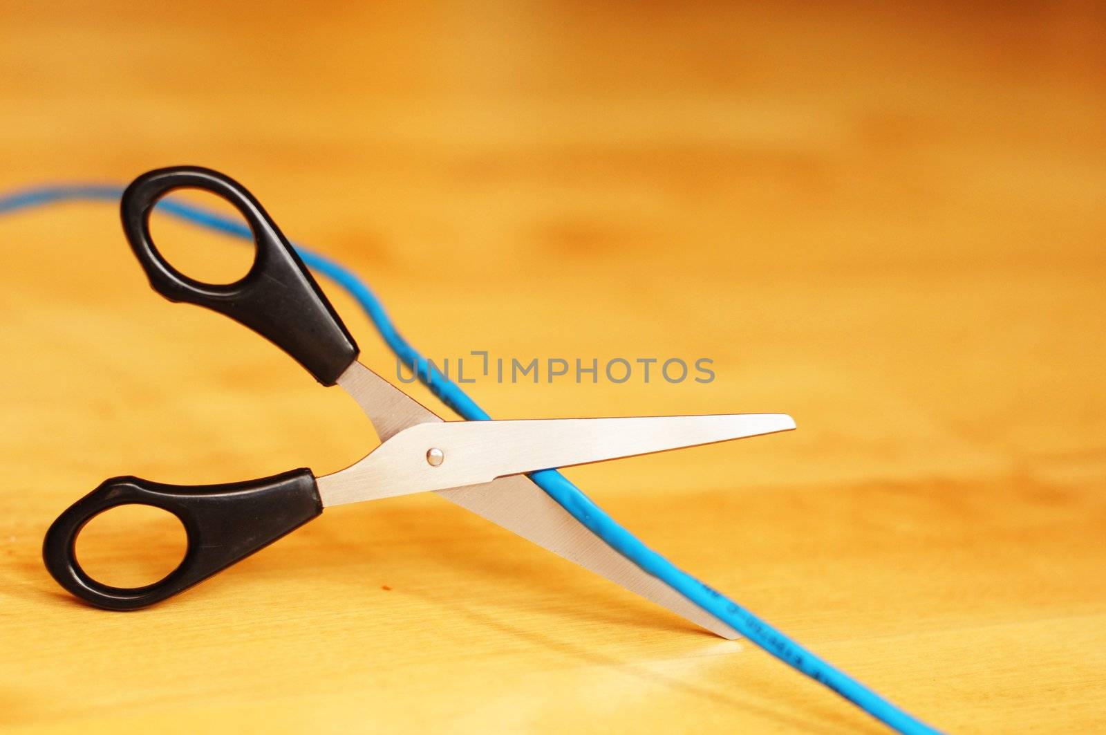 wireless lan or internet connection concept with laptop cable and scissors