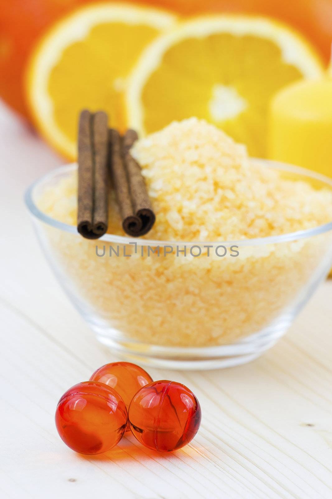 bowl of orange bath salt with fresh fruits - beauty treatment