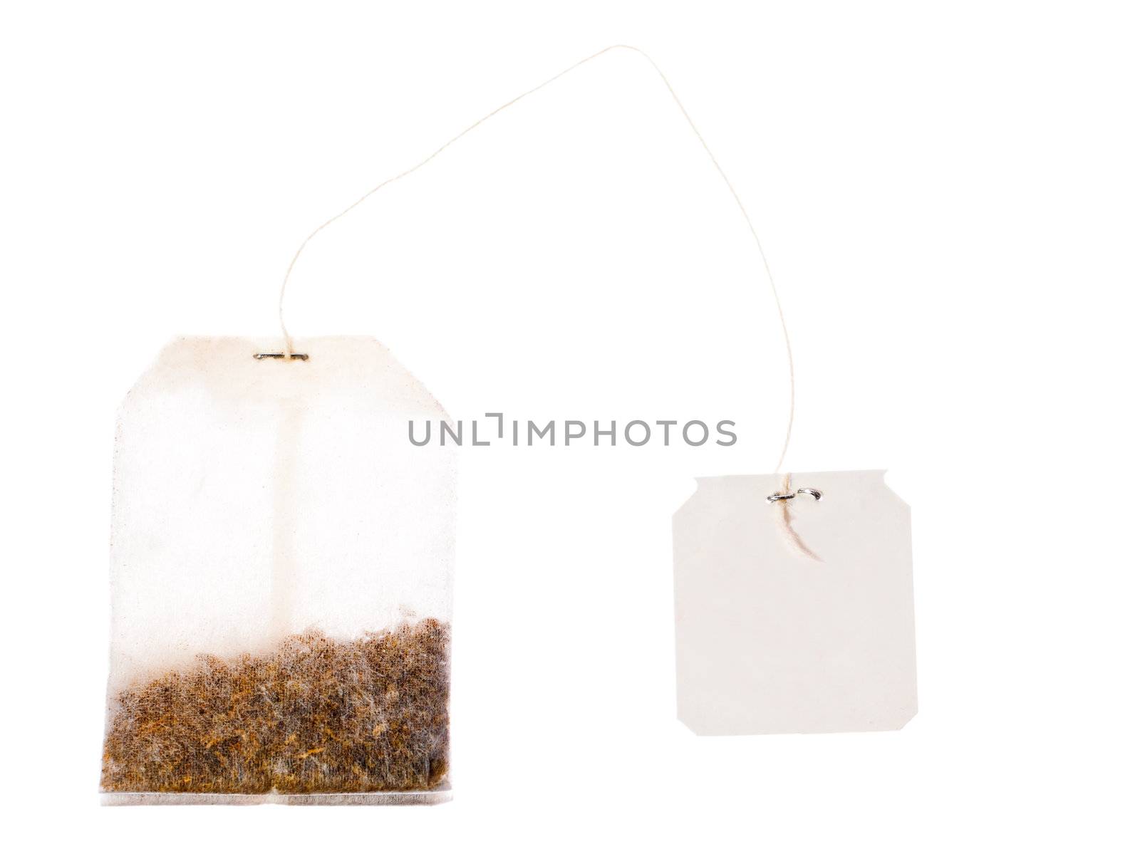 A tea bag with a blank labek on a string. Isolated over white with clipping path.