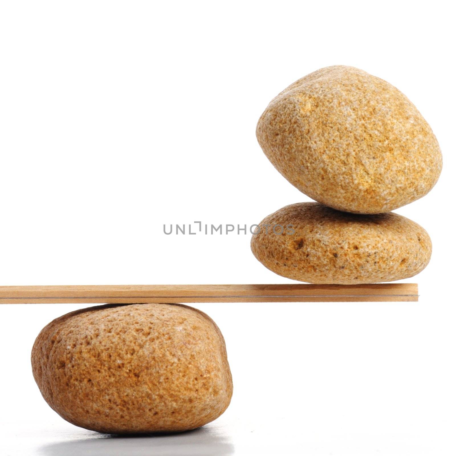 scales with zen stone isolated on white showing balance or spa