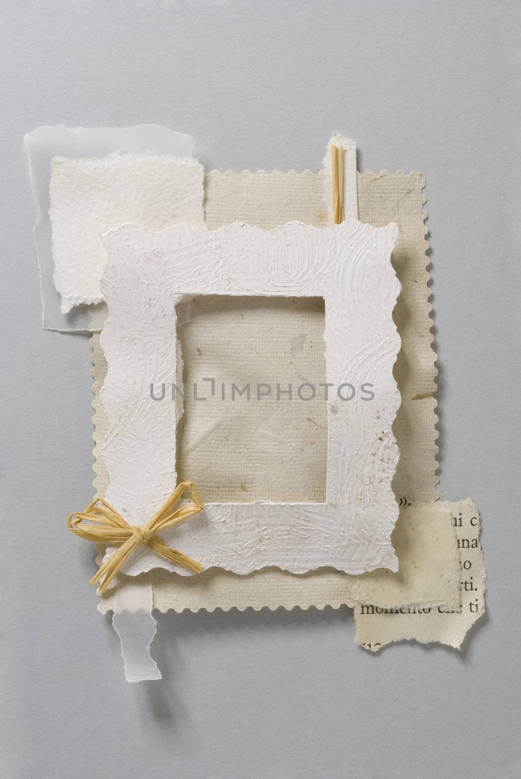 Paper frame made of pieces of paper with a little bow