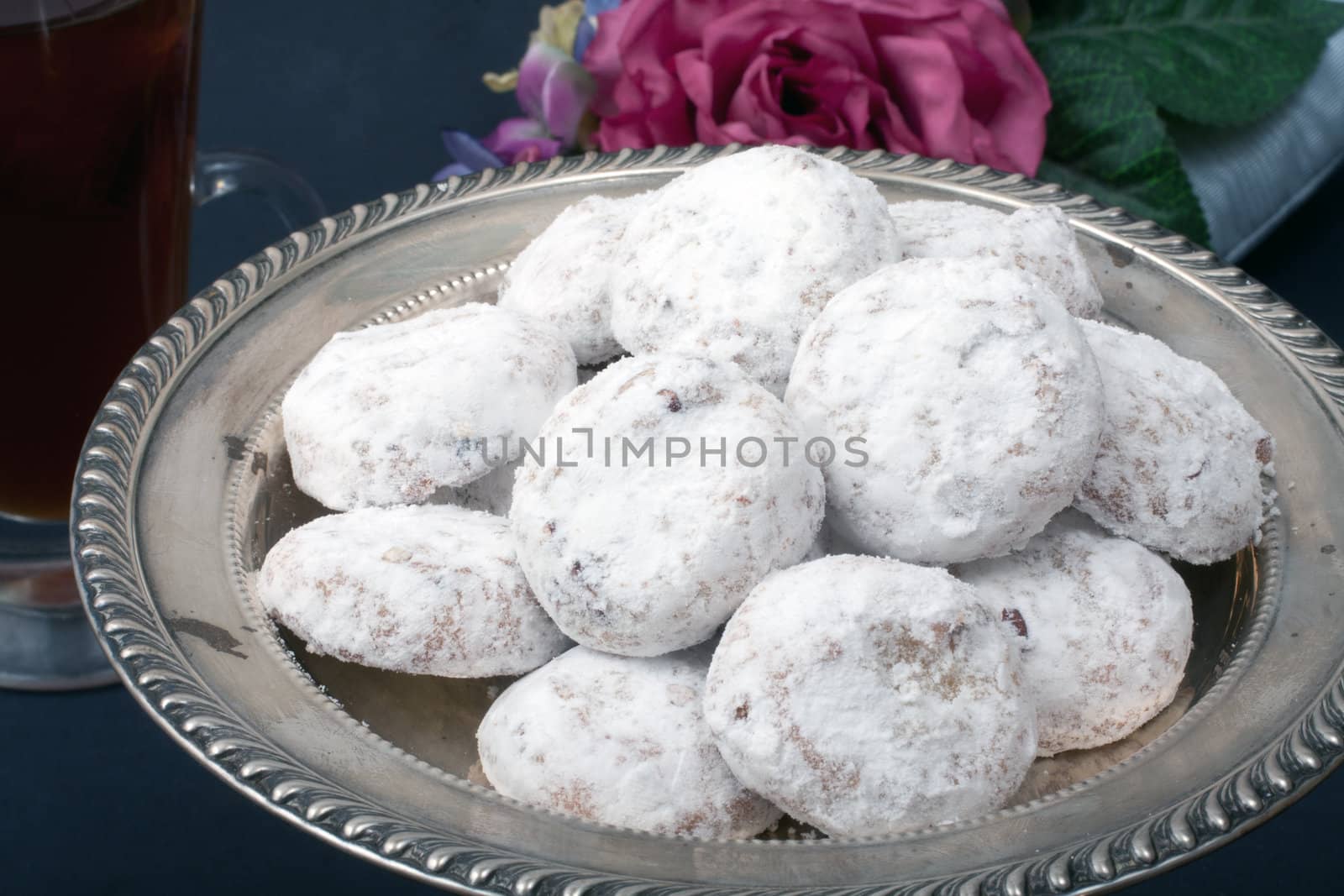 White Tea Cakes on a sterling silver tray on black background