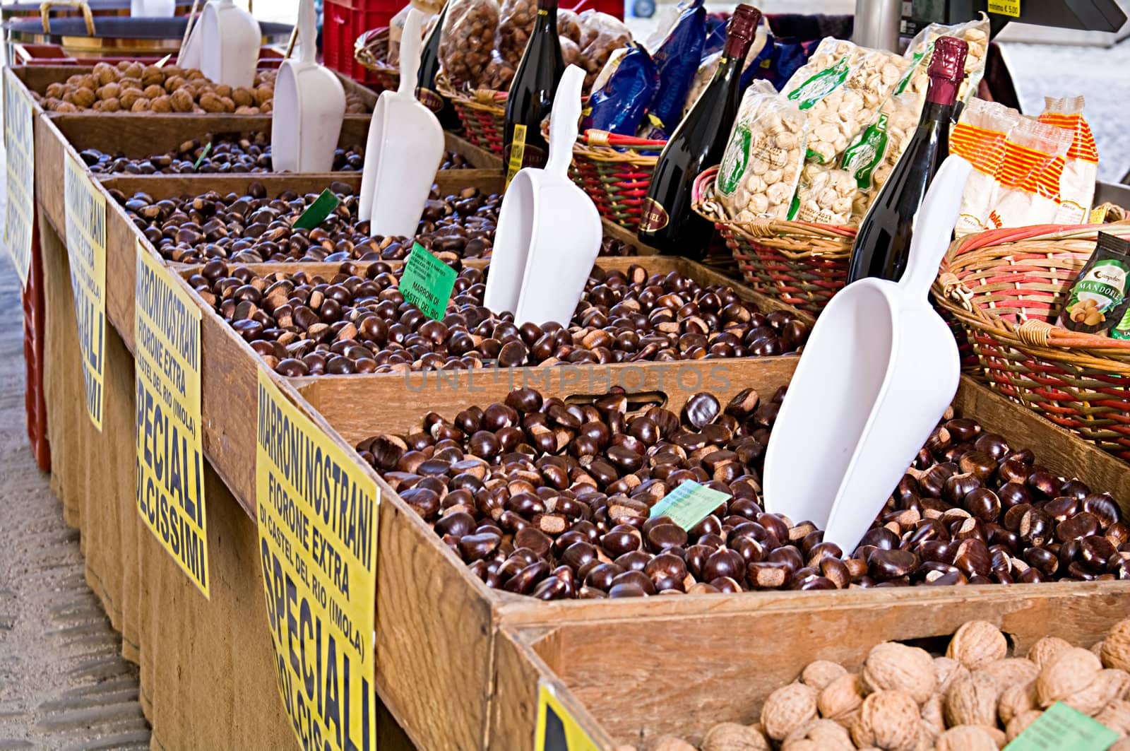 Market stall selling nuts, chesnuts and wine