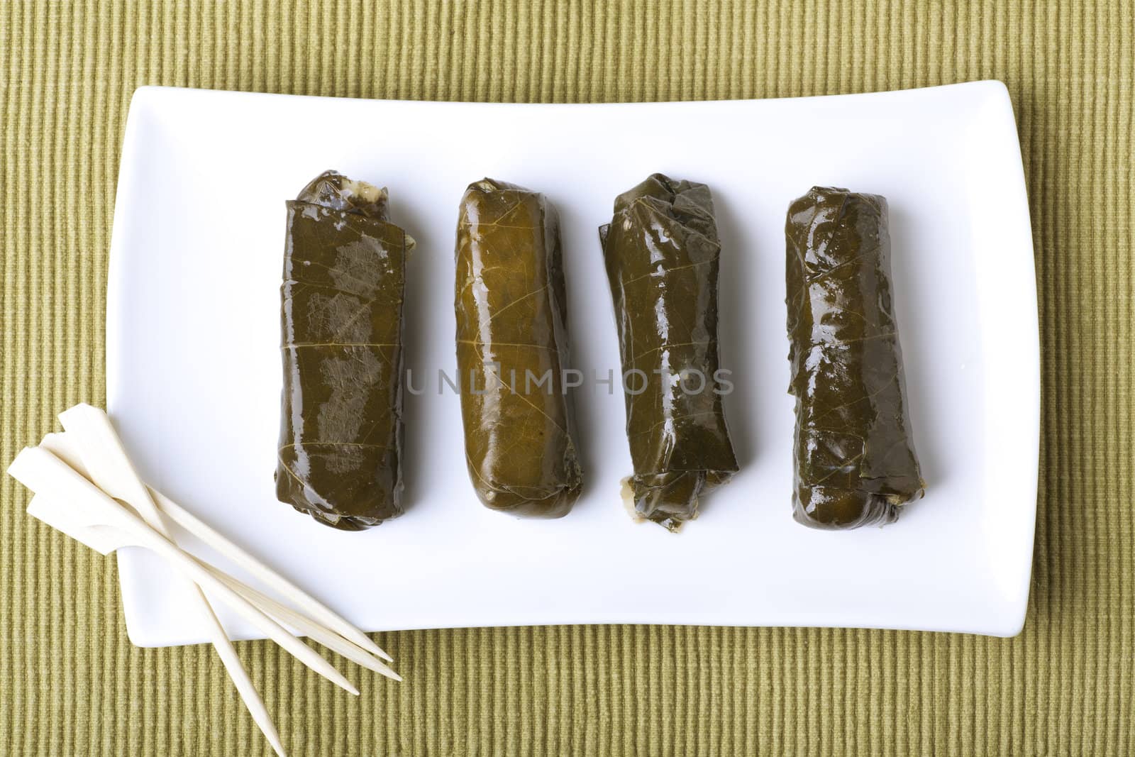 Appetizers: fresh grape leaves stuffed with rice.